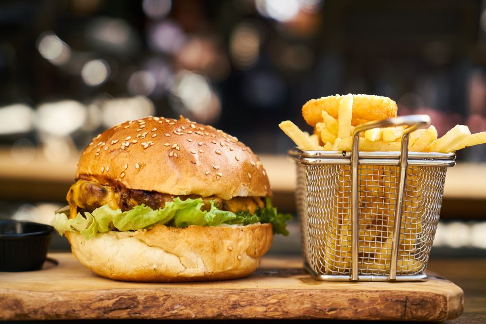 Double cheeseburger with a basket of fries