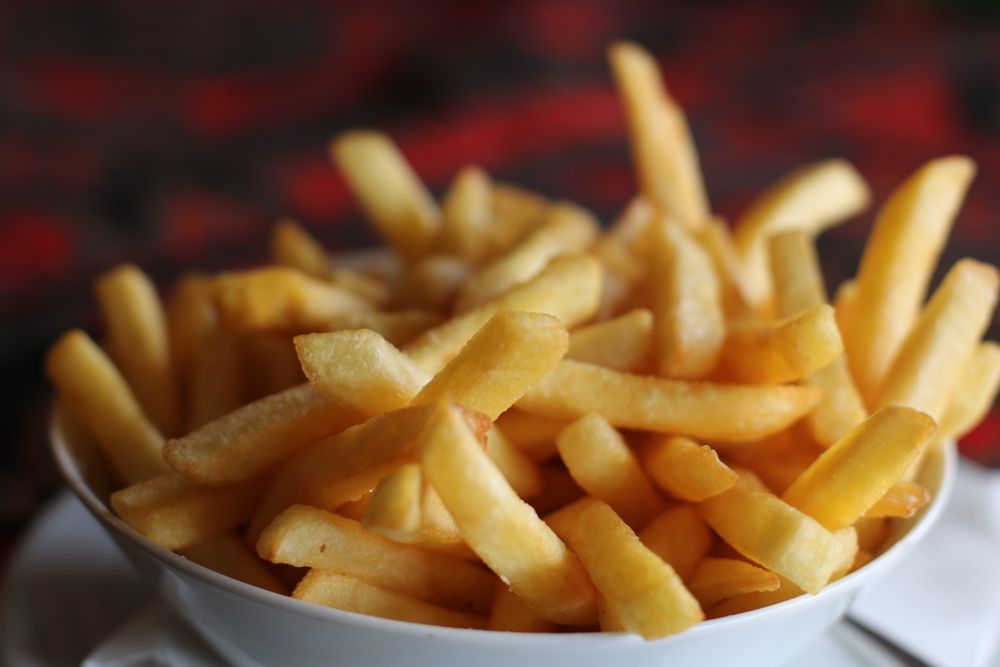 A bowl of golden skin-on fries